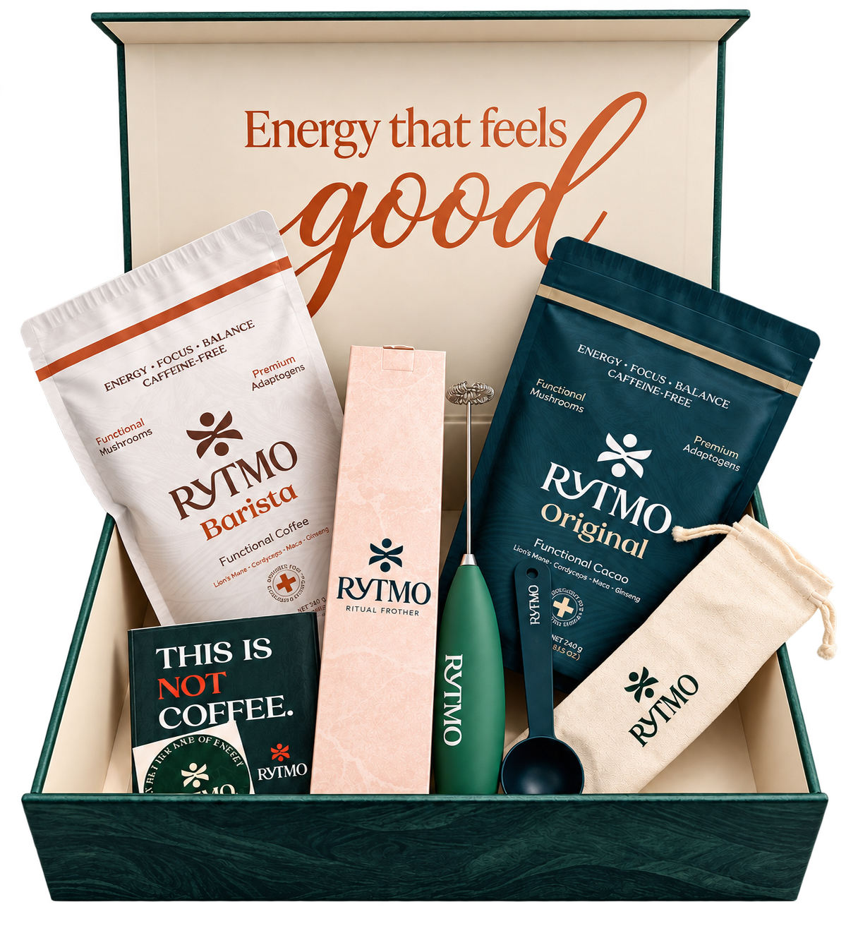A RYTMO wellness gift set displayed inside an open dark green box with the phrase 'Energy that feels good' printed inside the lid. The set includes a white bag of RYTMO Barista functional coffee, a pink box of RYTMO essential flowers, a dark teal bag of RYTMO Original functional coffee, a green manual blender, a small spoon, and a beige drawstring pouch.